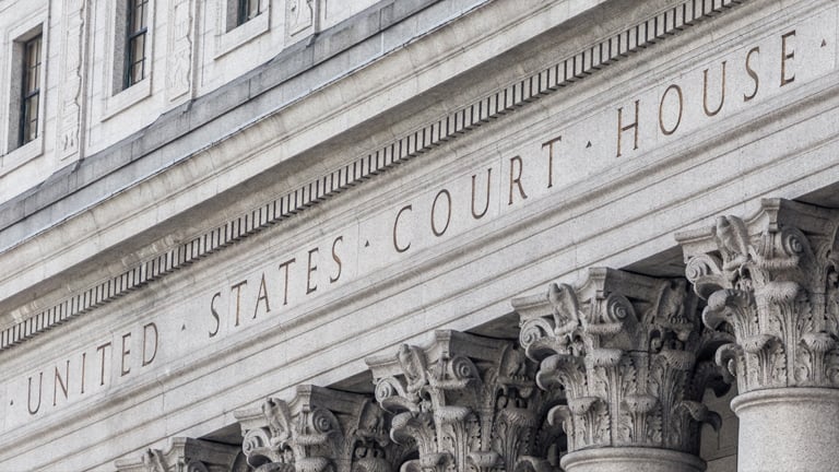 Close-up of carving on a stone lintel that reads United States Court House